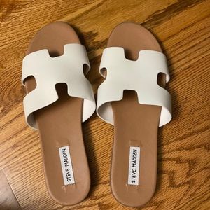 Steven Madden leather sandals in white.